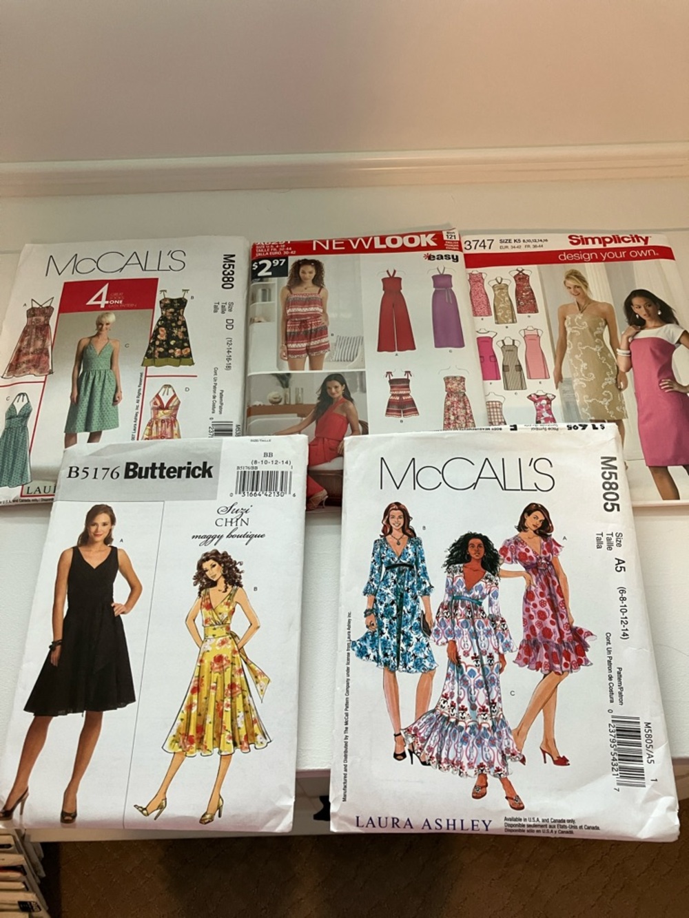 Five uncut women’s dress patterns sizes 6–18